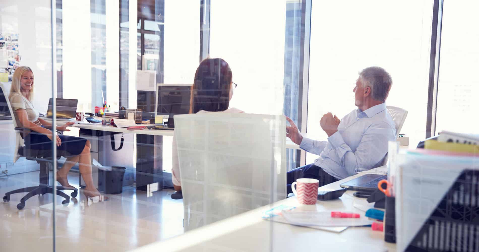 Group of people talking in the office